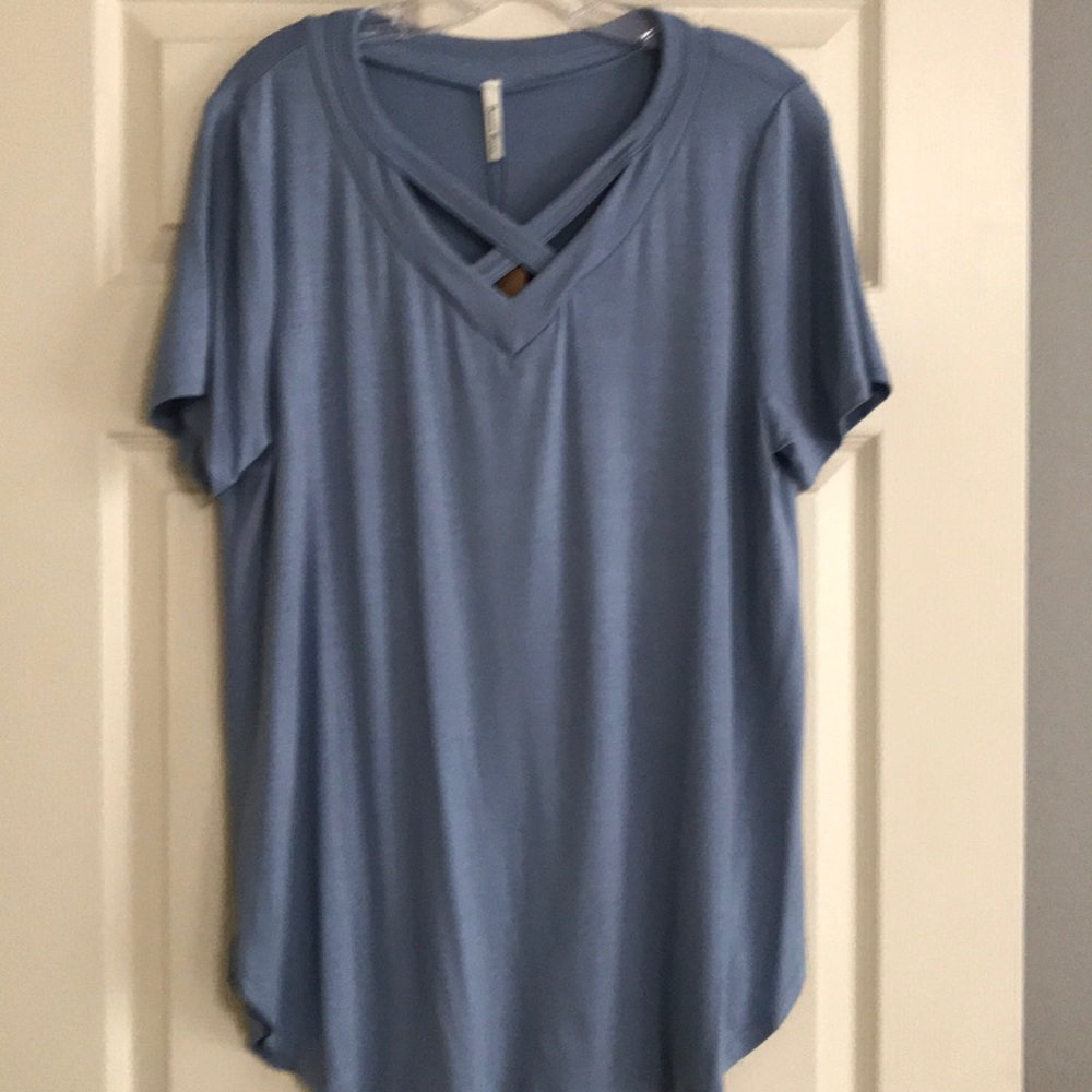 New. Women’s cross v-neck top.